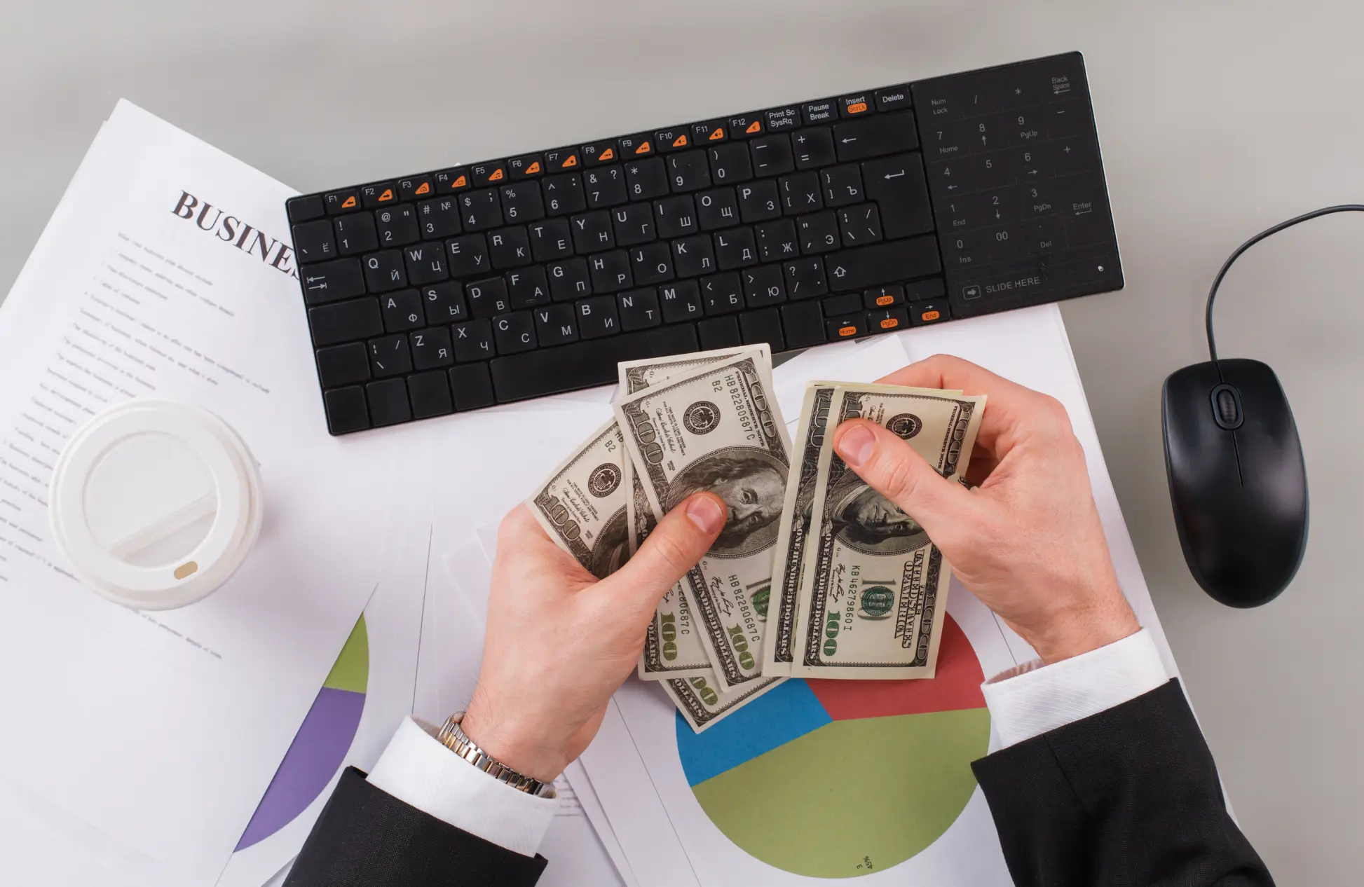 Businessman counting cash money in the office