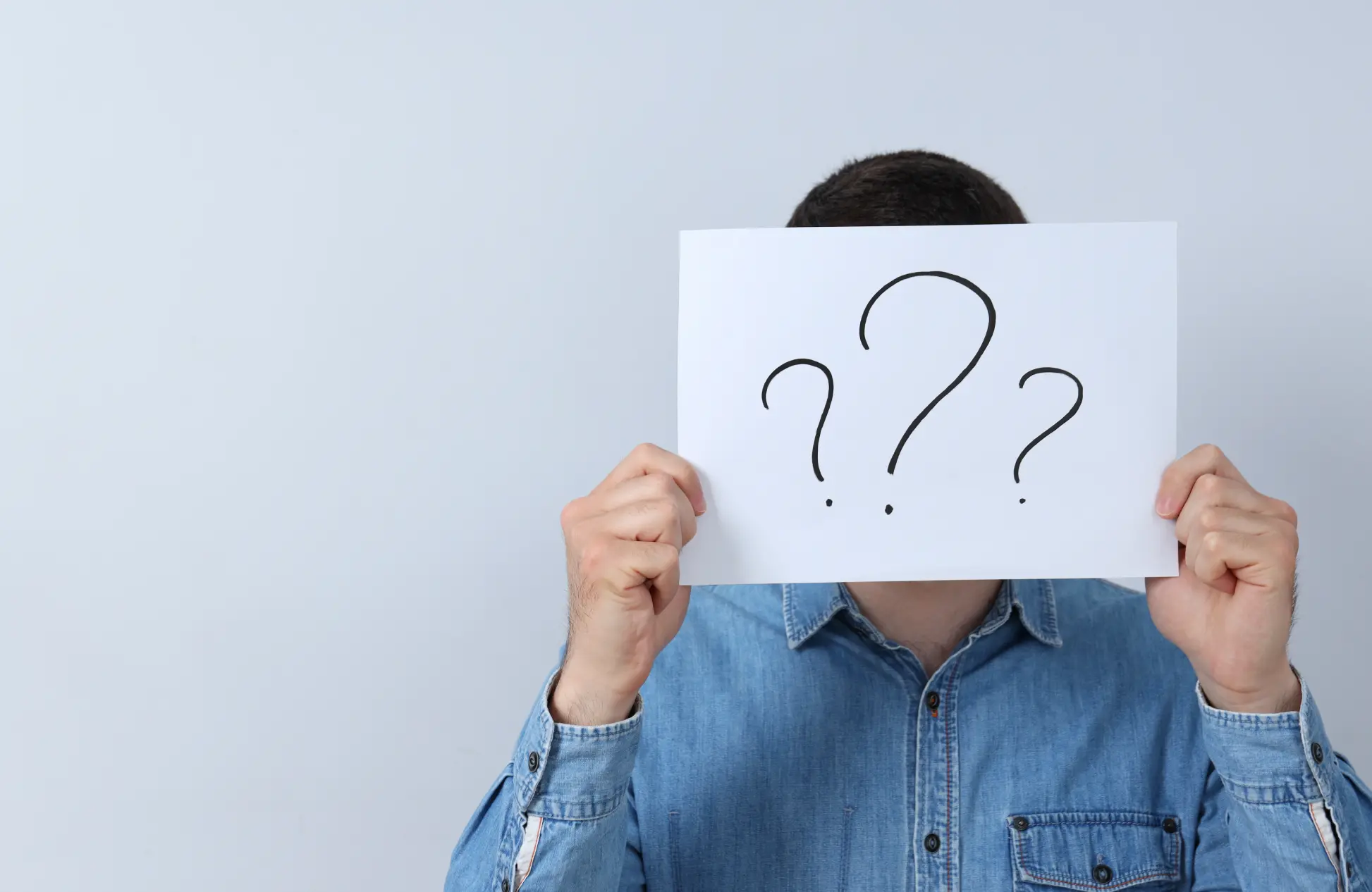 Man with paper in hands on white background