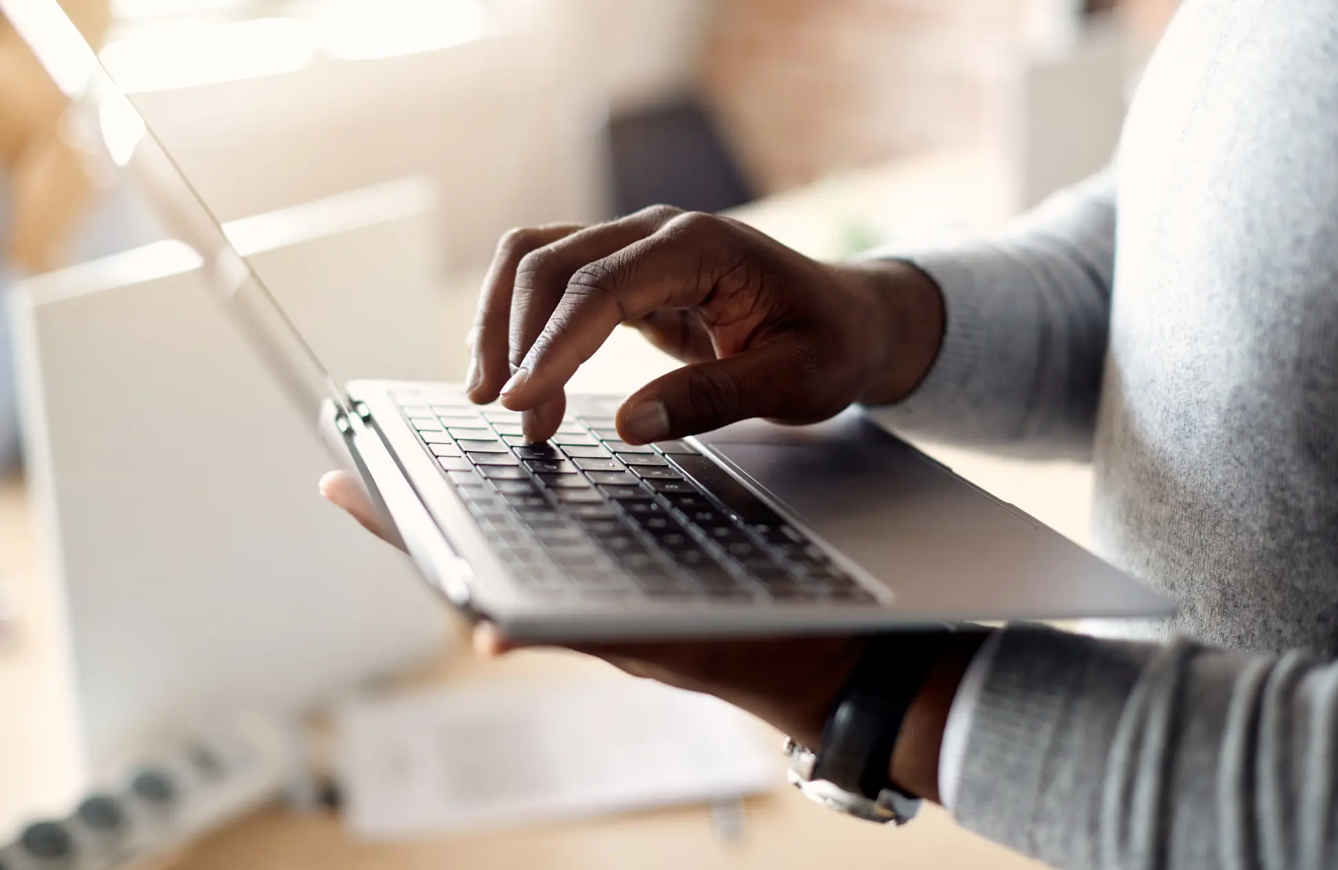 Close up of businessman using laptop