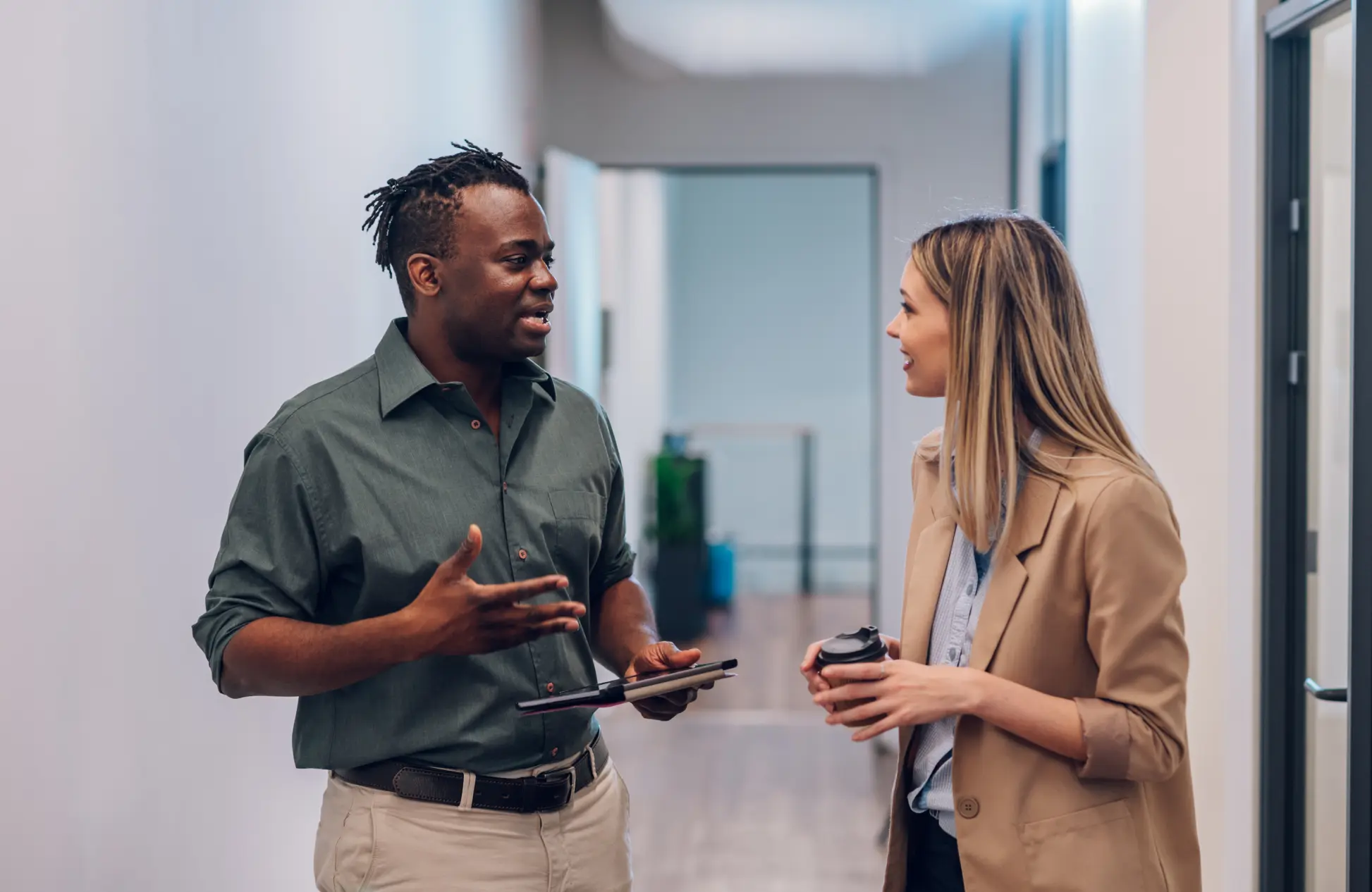 Two multiracial business colleagues working together